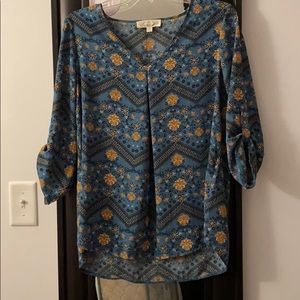 Light blue blouse with flowering design